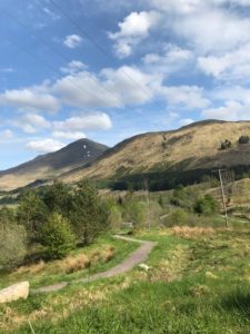 A hiking path towards the mountains in Chianlarich, Scotland