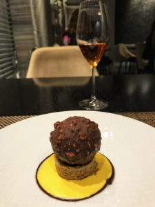 Dessert displayed on a plate with a glass of wine at Catle Terrace Restaurant in Edinburgh, Scotland