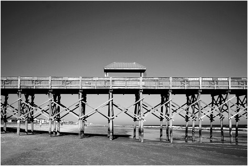 Black and white photo of the pier at Folly Beach, SC, near Charleston, SC
